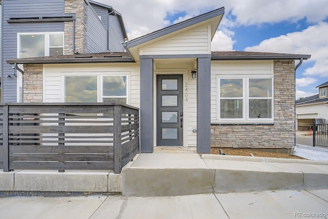 2404 W 69th Pl, Denver, CO 80221 - townhome / multi-family property featuring stone siding