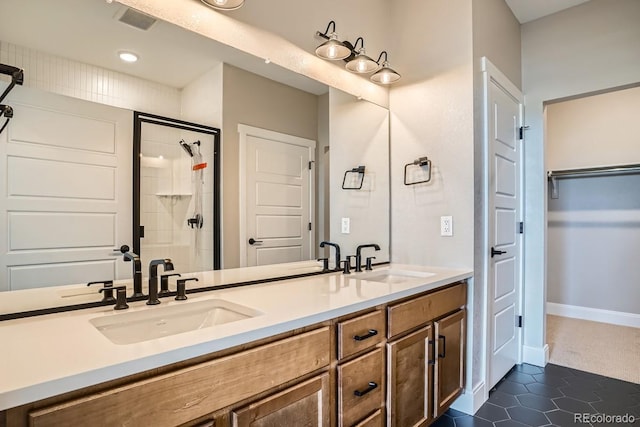 2404 W 69th Pl, Denver, CO 80221 - full bathroom with double vanity, a shower stall, a spacious closet, tile patterned flooring, and recessed lighting
