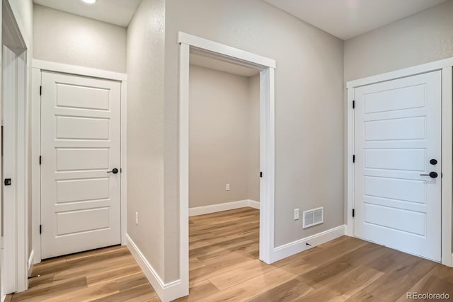 2404 W 69th Pl, Denver, CO 80221 - corridor with light wood-type flooring