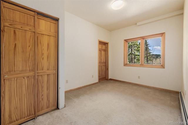 3581 Gap Rd, Golden, CO 80403 - unfurnished bedroom with light carpet, a baseboard radiator, and baseboards
