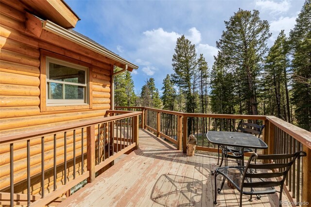 3581 Gap Rd, Golden, CO 80403 - wooden terrace with outdoor dining space