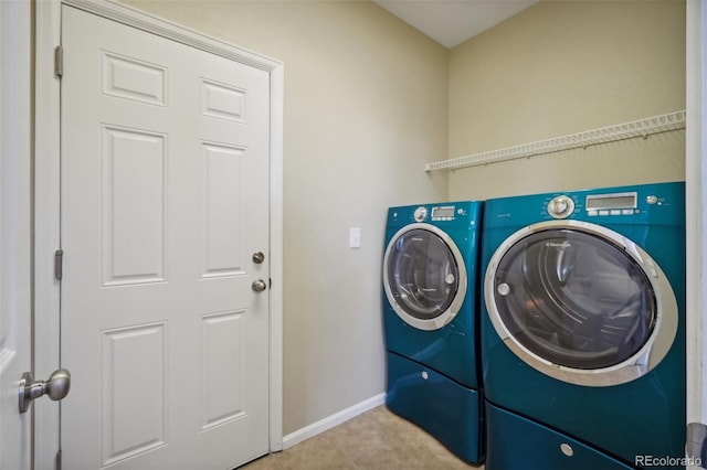 laundry room with washing machine and dryer