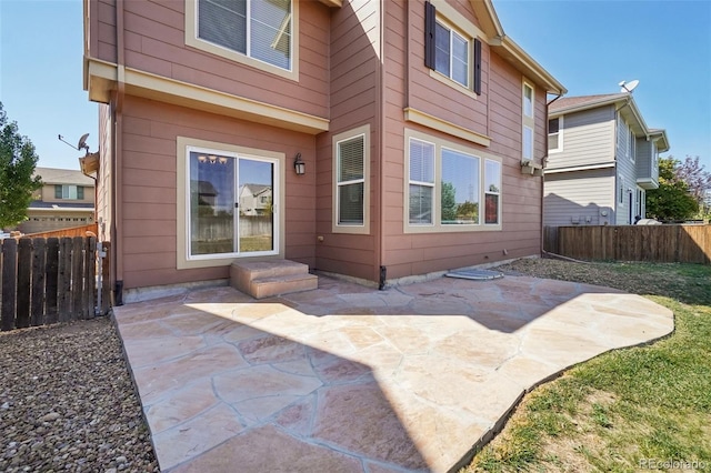 rear view of property featuring a patio area