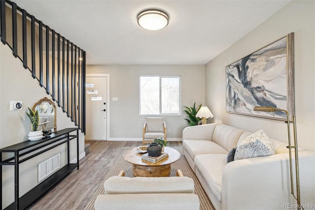 living room with light hardwood / wood-style floors