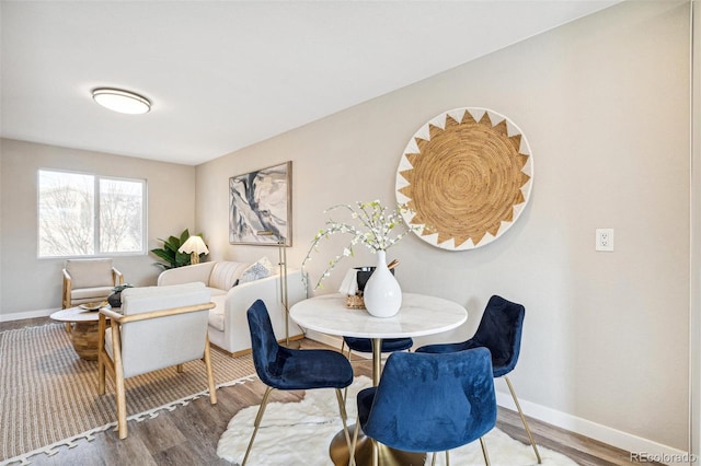 dining space featuring hardwood / wood-style floors