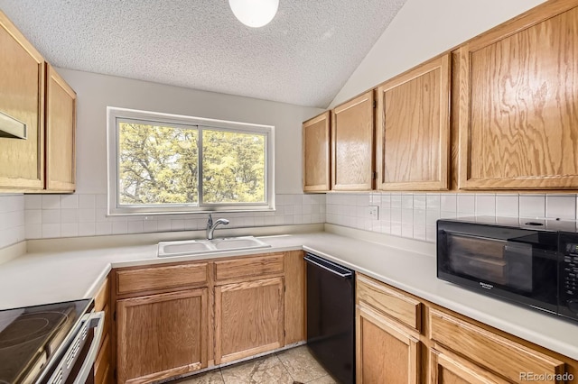 3558 S Depew St Unit 302, Denver, CO 80235 - kitchen with black appliances, a textured ceiling, lofted ceiling, a sink, and tasteful backsplash
