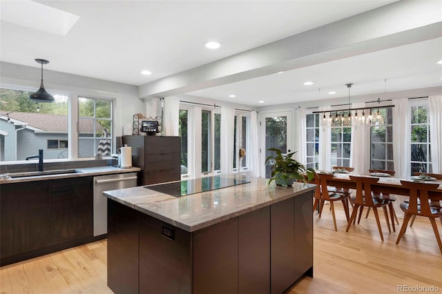 1502 Columbine Ave, Boulder, CO 80302 - kitchen featuring a sink, black electric stovetop, stainless steel dishwasher, light wood-style flooring, and modern cabinets