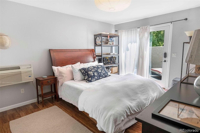 1502 Columbine Ave, Boulder, CO 80302 - bedroom featuring access to exterior, wood finished floors, a wall mounted air conditioner, and baseboards
