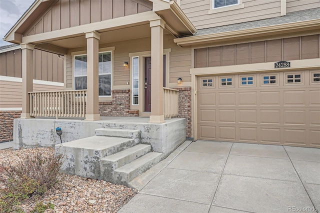 property entrance with an attached garage, roof with shingles, board and batten siding, a porch, and driveway