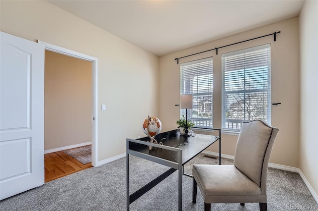 office area featuring baseboards, carpet, and visible vents