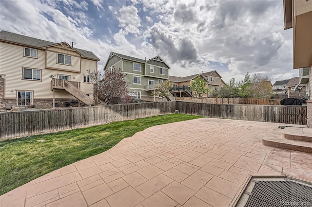 view of patio featuring a residential view and a fenced backyard