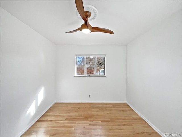 unfurnished room with ceiling fan and light wood-type flooring