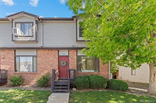 10693 W 63rd Dr Unit 106, Arvada, CO 80004 - multi unit property featuring brick siding and a front lawn