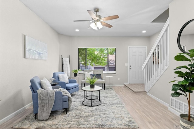 10693 W 63rd Dr Unit 106, Arvada, CO 80004 - living area featuring light wood-style floors, baseboards, ceiling fan, stairway, and recessed lighting