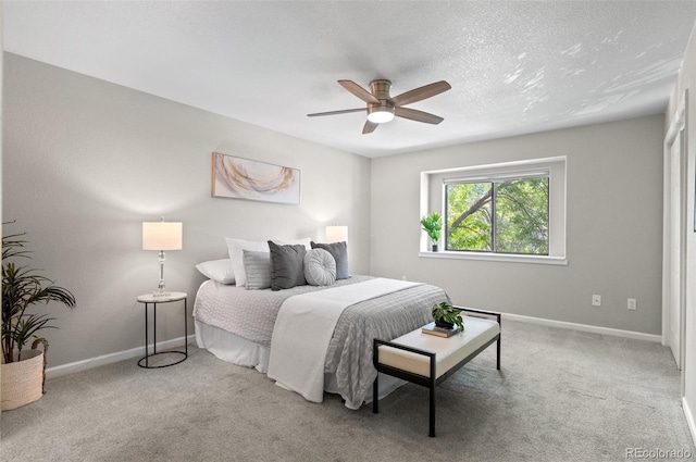 10693 W 63rd Dr Unit 106, Arvada, CO 80004 - bedroom with carpet, baseboards, and a ceiling fan