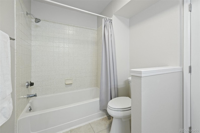 bathroom with tile patterned floors, shower / bath combination with curtain, and toilet