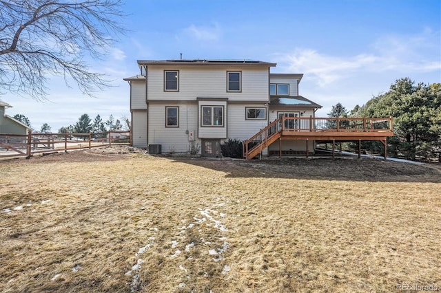 back of house with a deck, central air condition unit, stairs, and fence