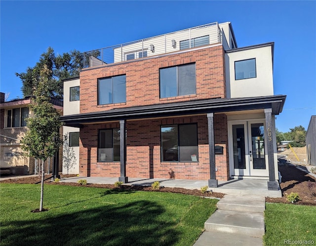 modern home featuring a front yard