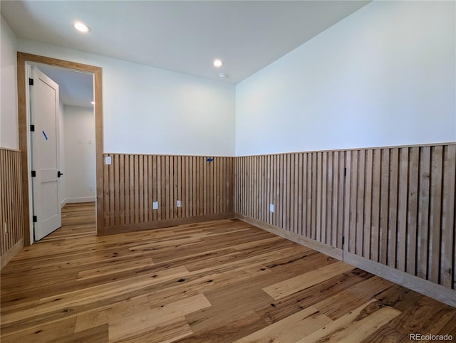 spare room featuring light hardwood / wood-style flooring