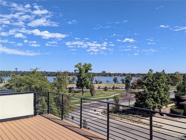 wooden terrace with a water view