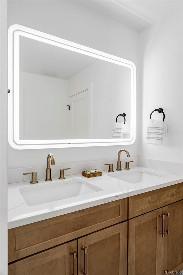 bathroom featuring double vanity and a sink