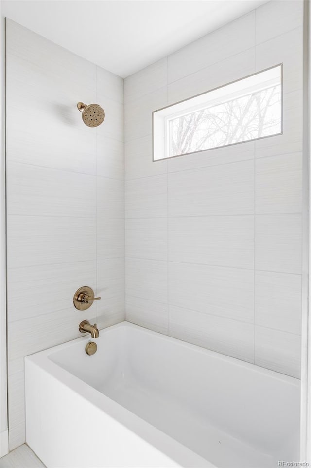 bathroom with shower / bathing tub combination