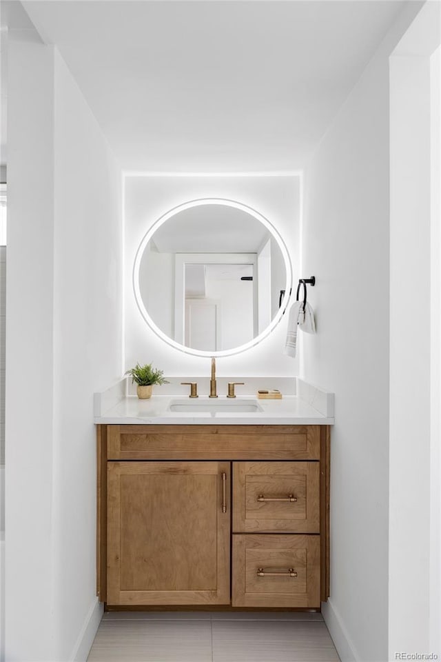 bathroom with vanity and baseboards