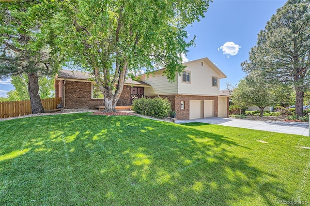 11410 W 72nd Pl, Arvada, CO 80005 - tri-level home featuring brick siding, an attached garage, and driveway