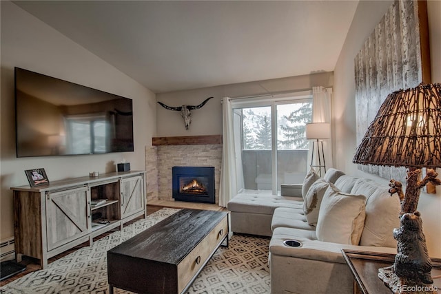 living room featuring a stone fireplace and lofted ceiling