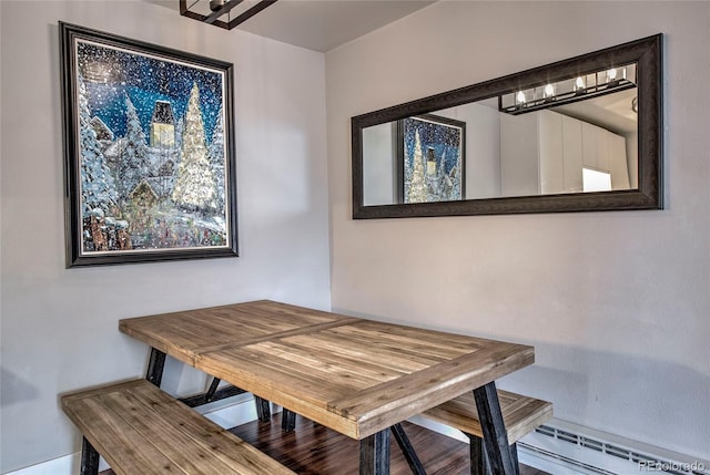 dining room featuring a baseboard heating unit