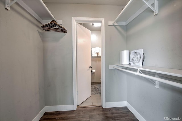 spacious closet with wood finished floors