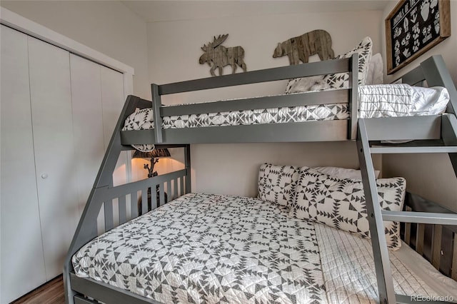 bedroom featuring a closet and wood finished floors