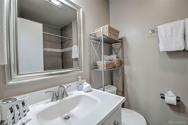 bathroom with toilet and vanity