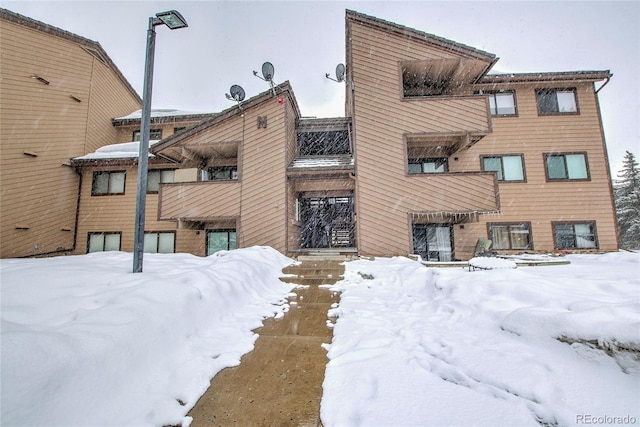 view of snow covered property