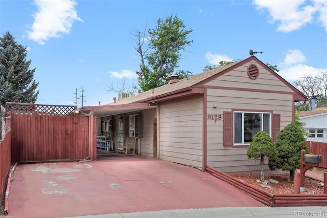 9129 Rampart St, Denver, CO 80260 - view of home's exterior with a central air condition unit and a patio