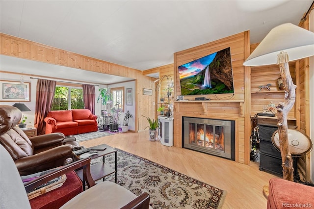 9129 Rampart St, Denver, CO 80260 - living room with wood finished floors, wooden walls, and a glass covered fireplace