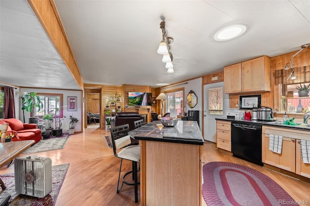 9129 Rampart St, Denver, CO 80260 - kitchen with dishwasher, open floor plan, dark countertops, and healthy amount of natural light