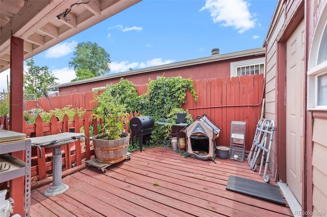 9129 Rampart St, Denver, CO 80260 - deck featuring a grill and a fenced backyard