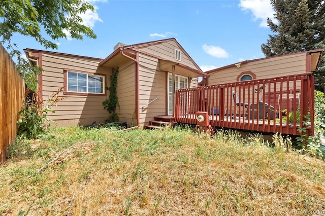9129 Rampart St, Denver, CO 80260 - view of side of home with a deck