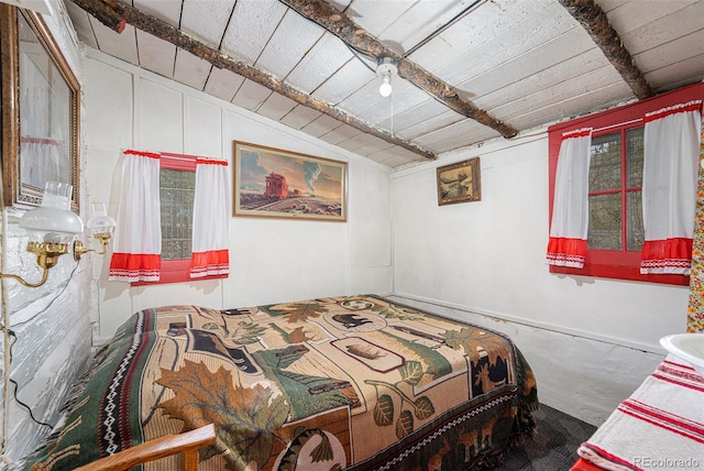 bedroom with lofted ceiling and wooden ceiling