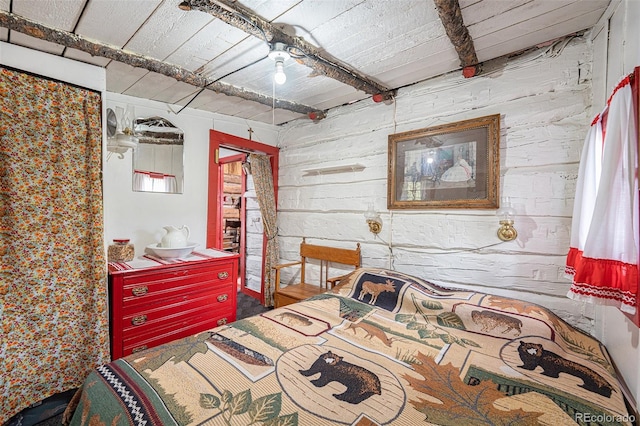 bedroom with beamed ceiling and wood ceiling