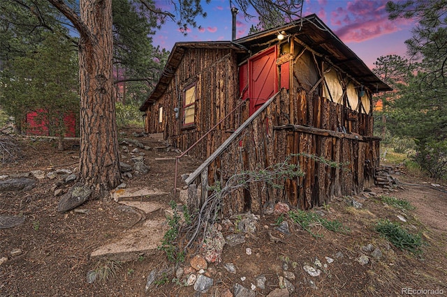 view of property exterior at dusk