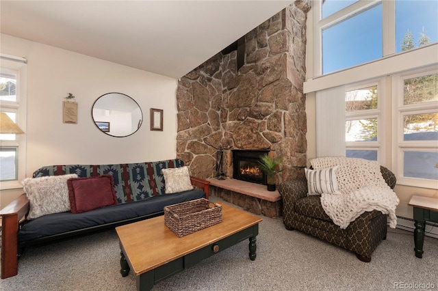 carpeted living room with high vaulted ceiling and a fireplace