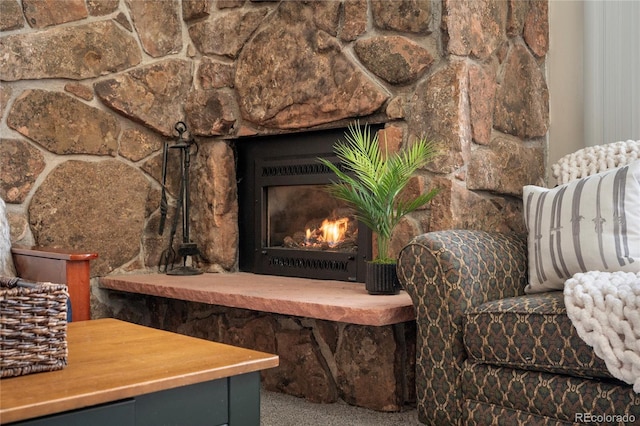 living area with a warm lit fireplace