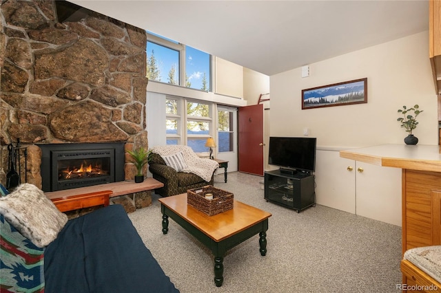 217 Van Anderson Dr Unit 6, Winter Park, CO 80482 - living room featuring light carpet and a stone fireplace