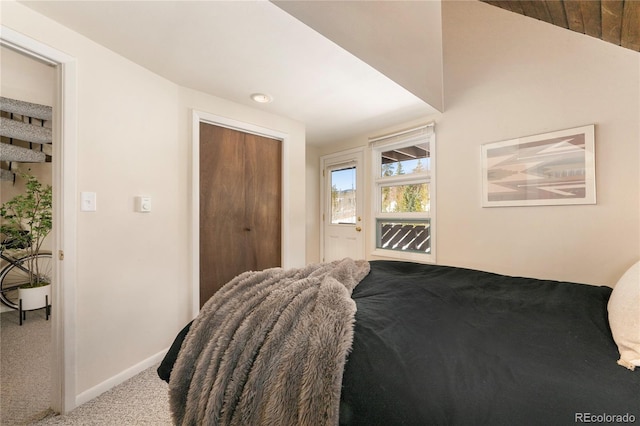 217 Van Anderson Dr Unit 6, Winter Park, CO 80482 - carpeted bedroom featuring baseboards, a closet, and access to exterior