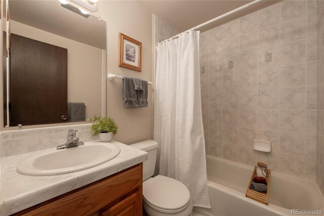 217 Van Anderson Dr Unit 6, Winter Park, CO 80482 - full bathroom with toilet, shower / tub combo with curtain, and vanity