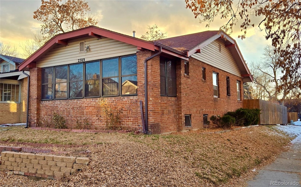 view of property exterior at dusk