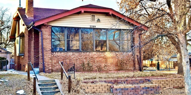 view of front facade with a sunroom