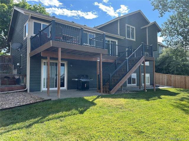 1495 Goldsmith Dr, Highlands Ranch, CO 80126 - rear view of property with a patio and a deck